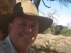 John out on a walking safari at The Hide, Hwange NP - look how close the elephant is!!